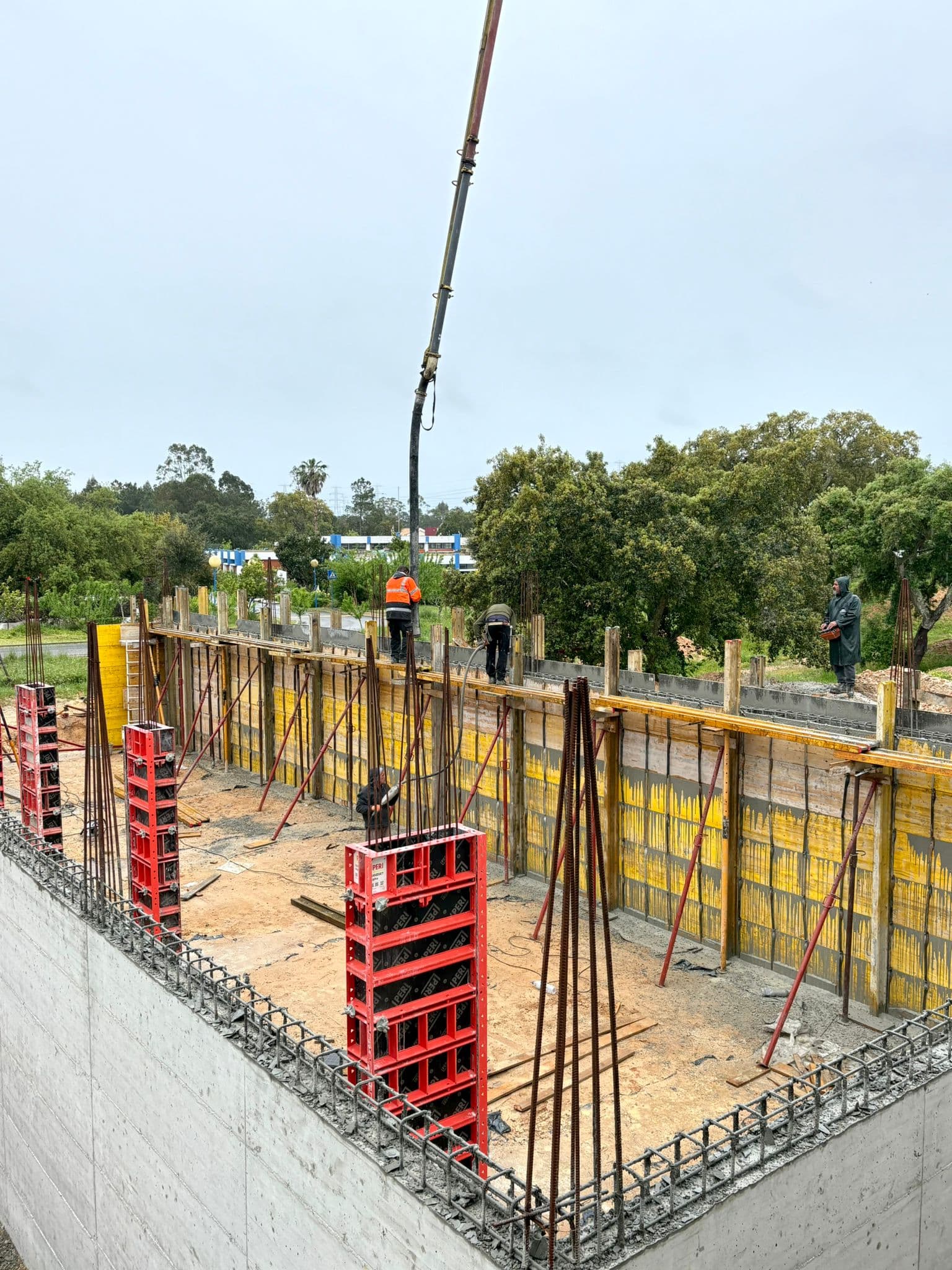 Workers assembling formwork panels