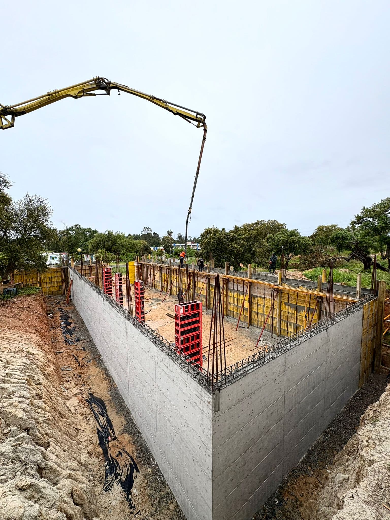 Workers assembling formwork panels