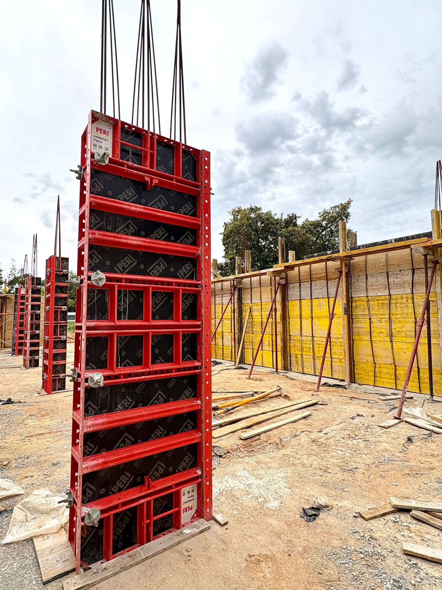Workers assembling formwork panels