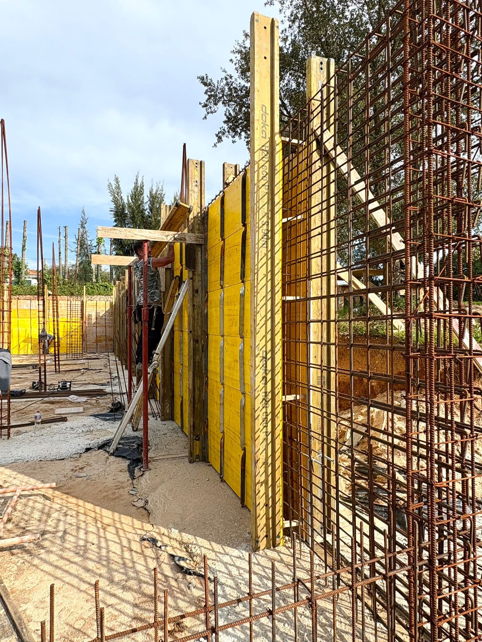 Workers assembling formwork panels