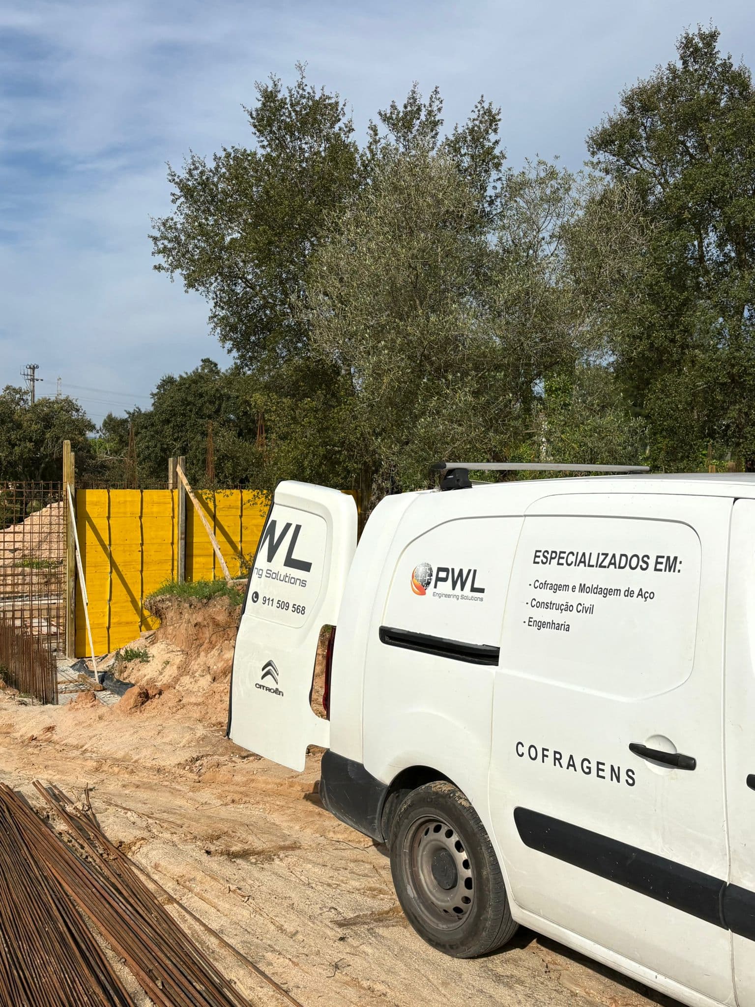 Workers assembling formwork panels