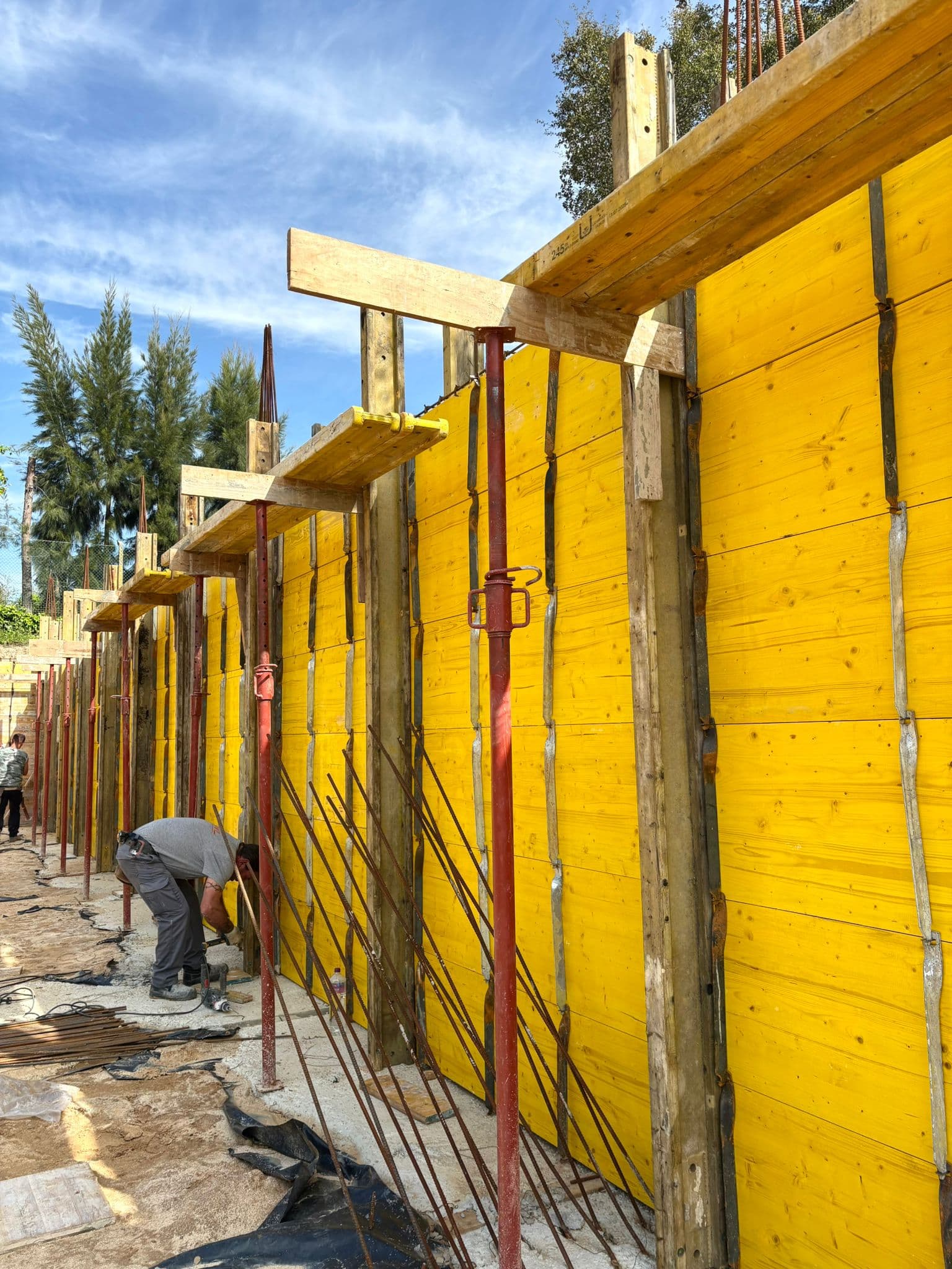 Workers assembling formwork panels