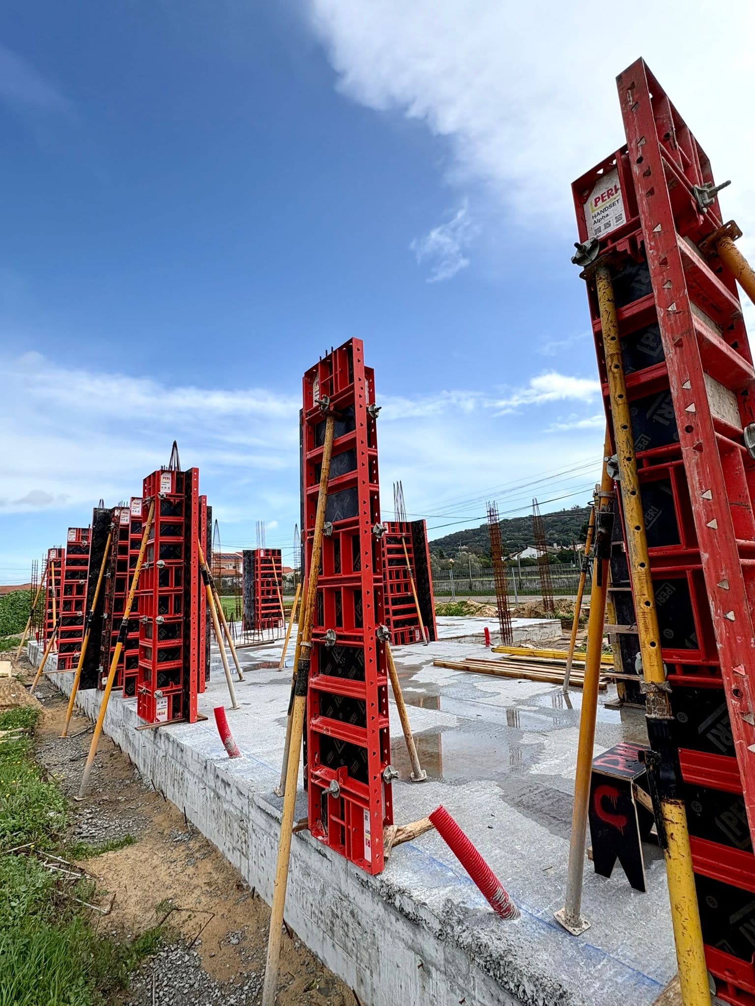 Workers assembling formwork panels