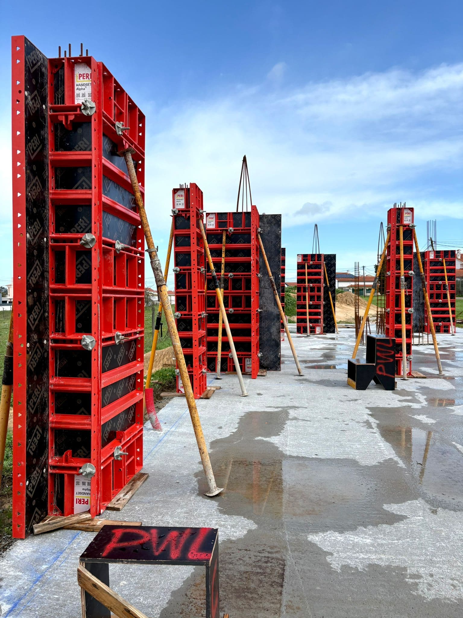 Workers assembling formwork panels