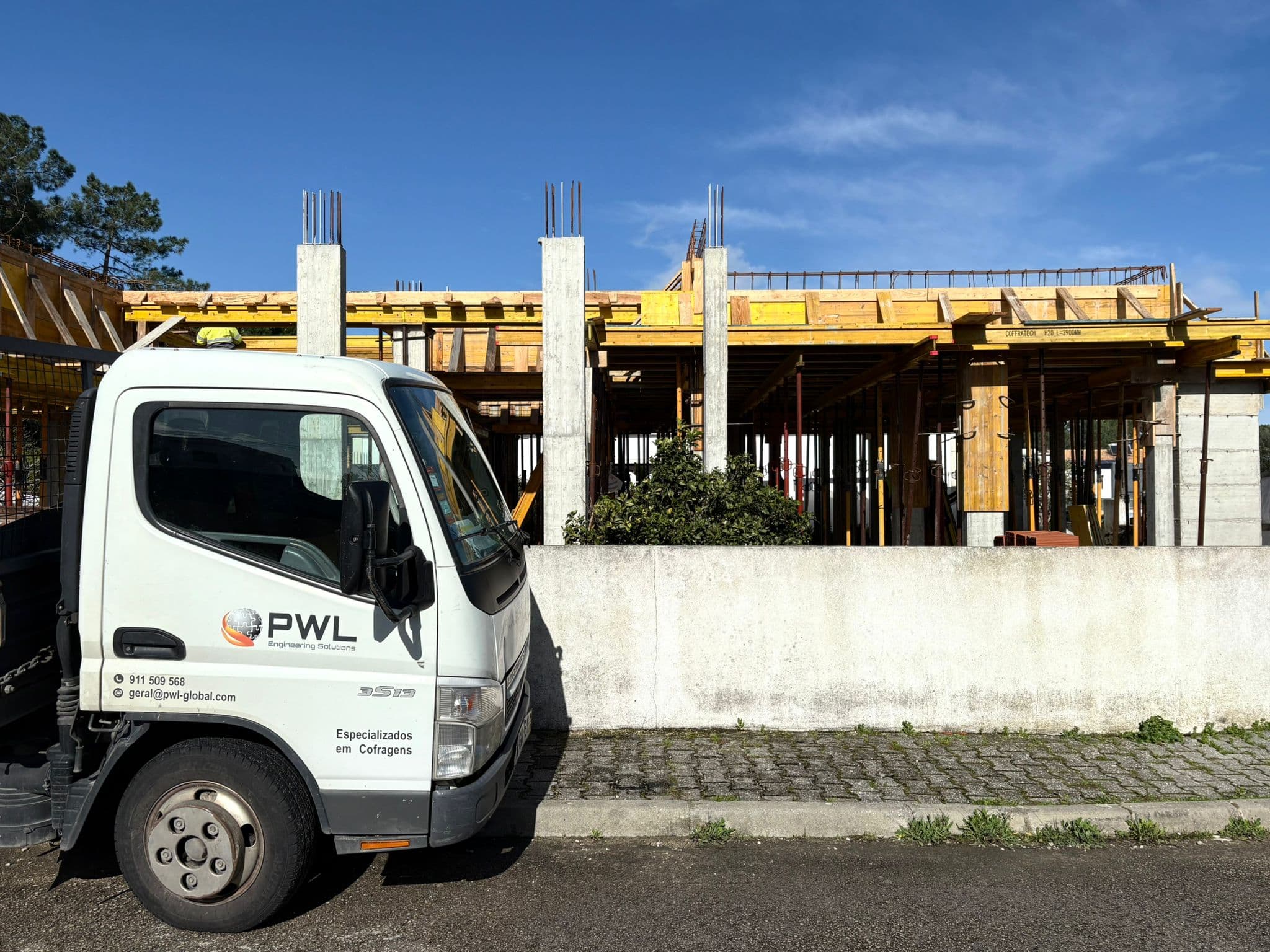 Workers assembling formwork panels